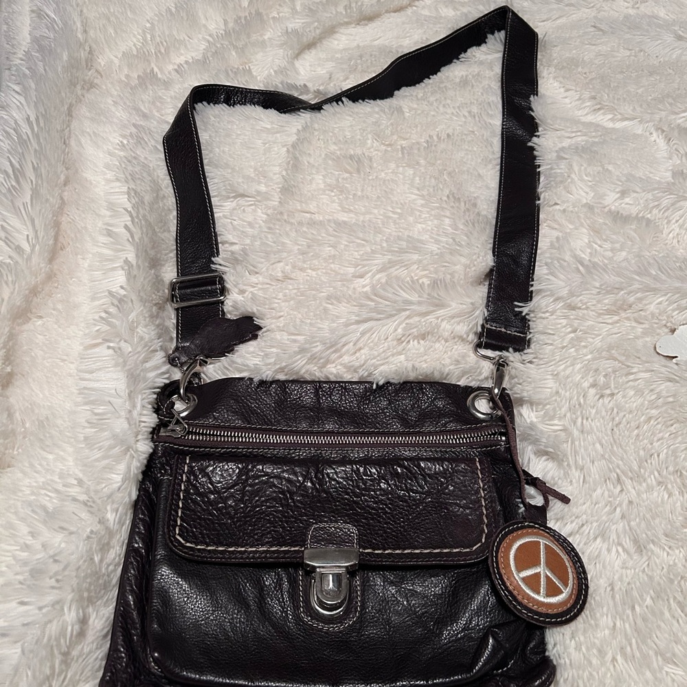 Roots Brown Leather Crossbody Bag with Brown Peace Charm